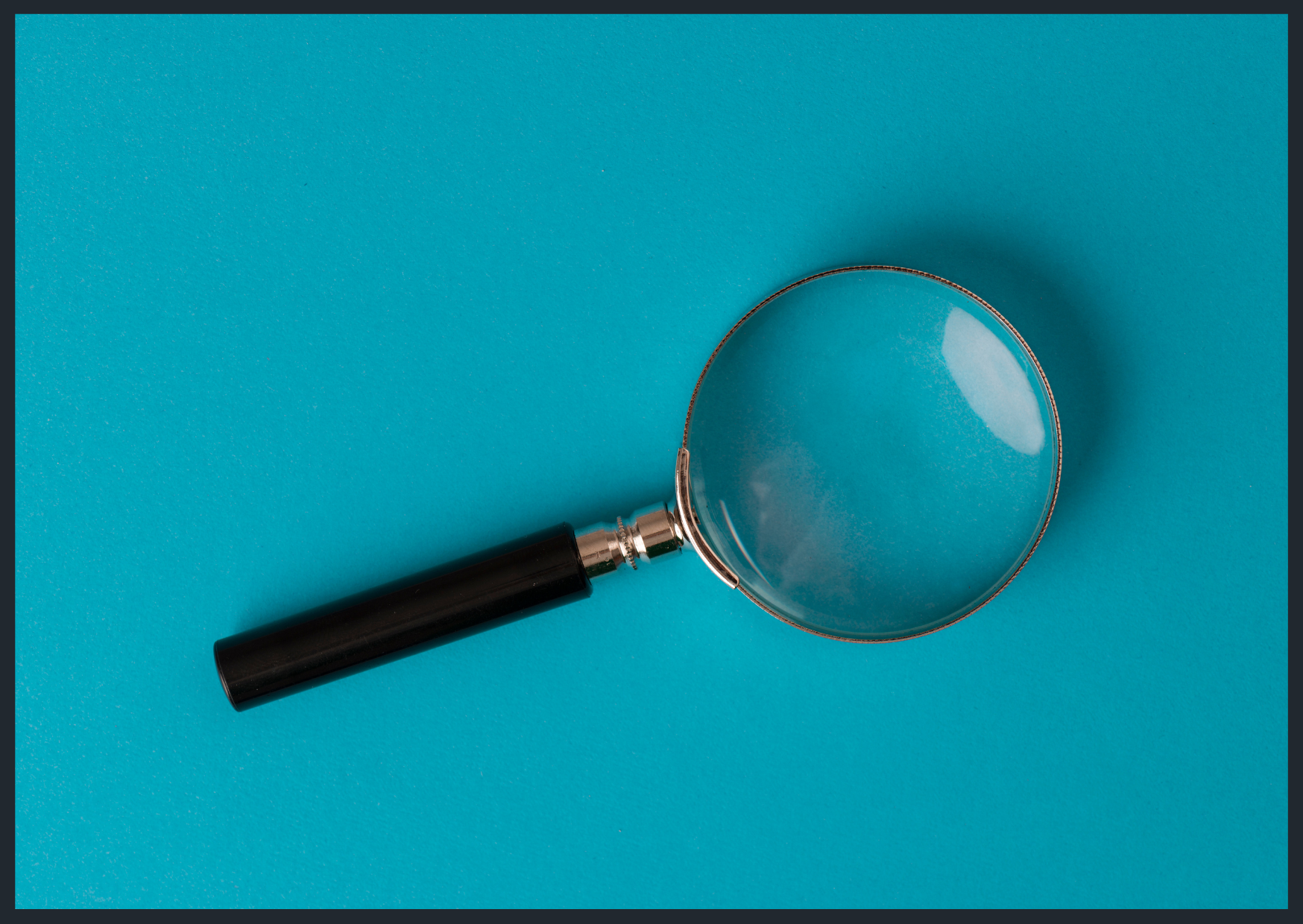 Magnifying glass on blue background