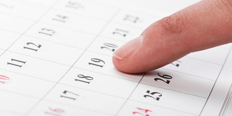 Image of finger pointing to calendar date