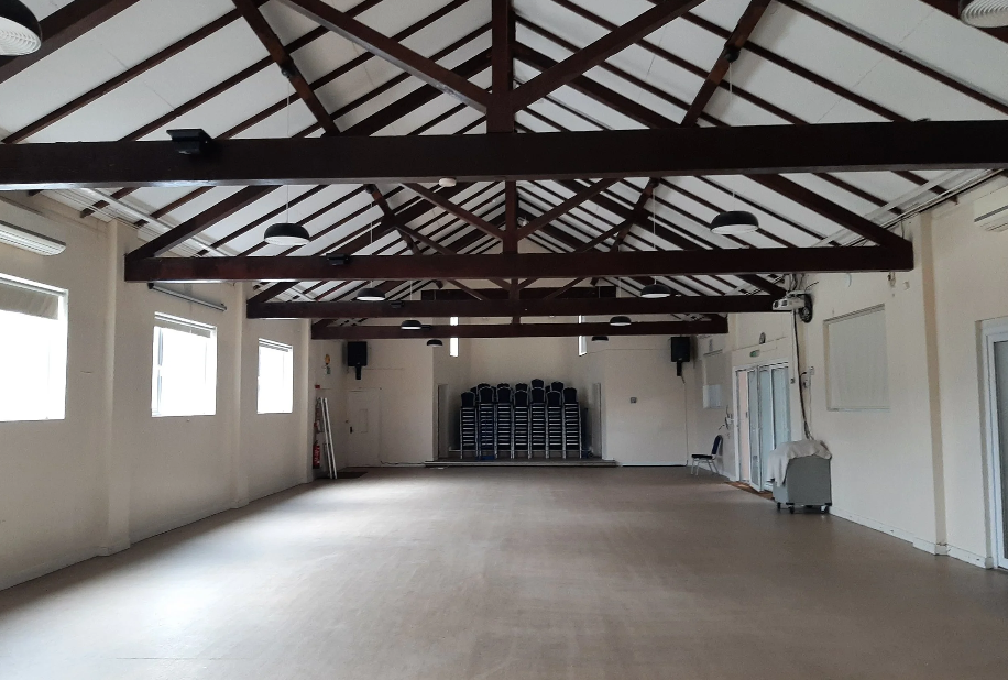 Large hall with stacks of chairs
