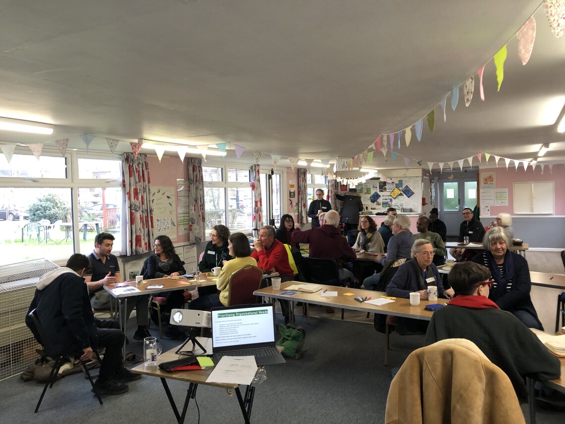 People sitting at tables talking