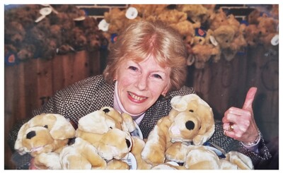 Pat Spence posing with soft toys!